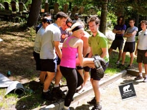 Mowglis staff members practice a "Spinal Injury Lift and Carry" during a Wilderness First Aid Certification Course