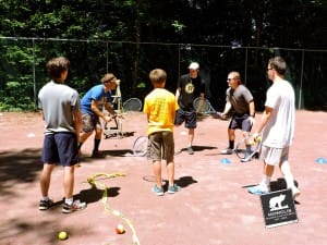 Former Mowglis Alum John Rafferty teaches coaching techniques to tennis staff