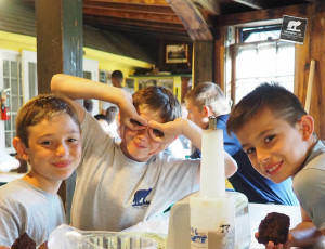 Campers enjoying a meal in the dining hall.
