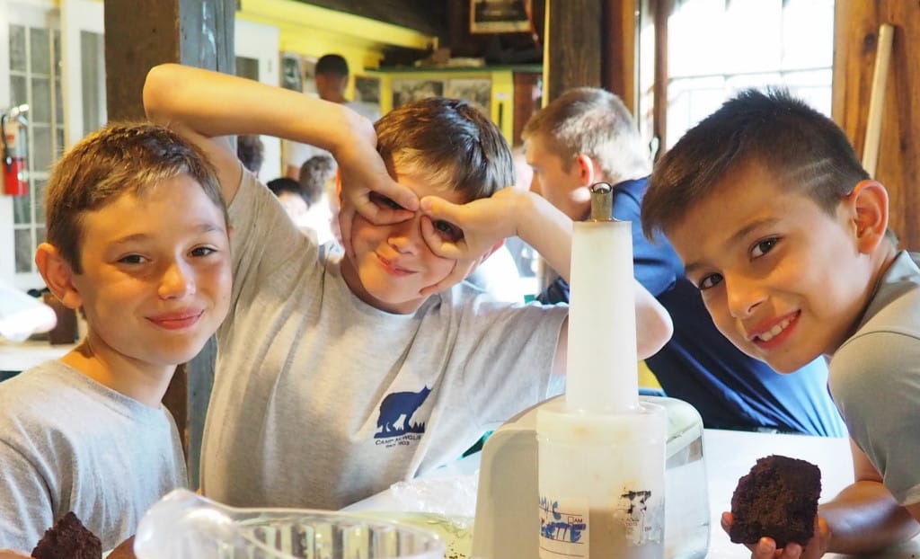 Campers enjoying a meal in the dining hall. 