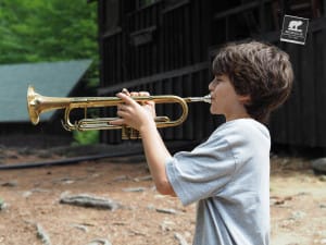 Campers can learn how to play the bugle and trumpet by working towards the "Golden Cord" Ribbon, or the Bugling Ribbon.