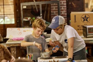 Boys Working on a Project Together at Camp Mowglis