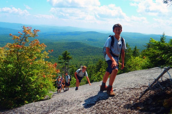 Hiking at summer boys' camp in New Hampshire